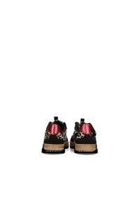 Back view of NALA sneaker with red heel accent