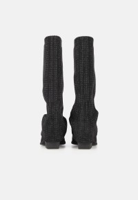 Rear view of the LOIS boots as a pair, shafts upright