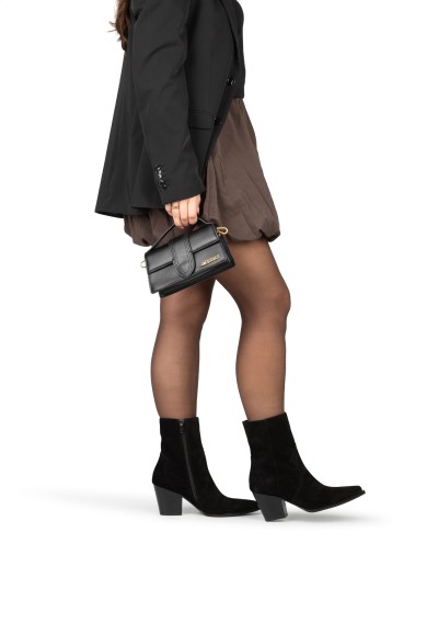 Black suede ankle boots styled with dress – HABOOB BEAU on model