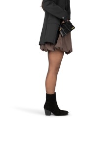 Black suede HABOOB BEAU boots styled with skirt – side view on foot