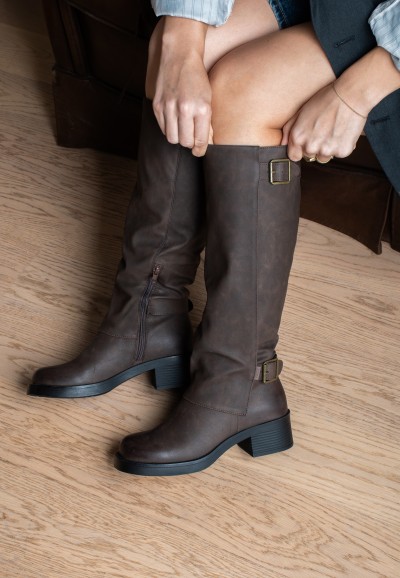 Women’s biker boots styled with dress