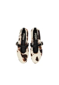 Top view of the Gina cow print ballerinas