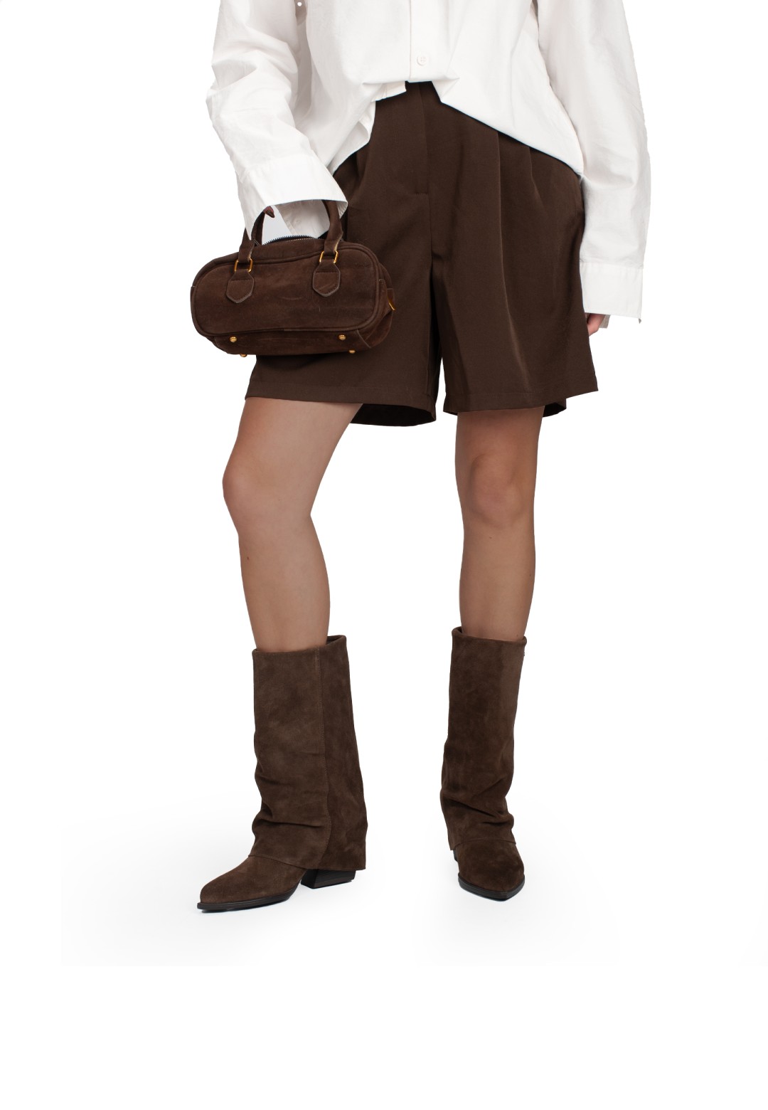 Model wearing CELESTE boots with brown shorts and bag