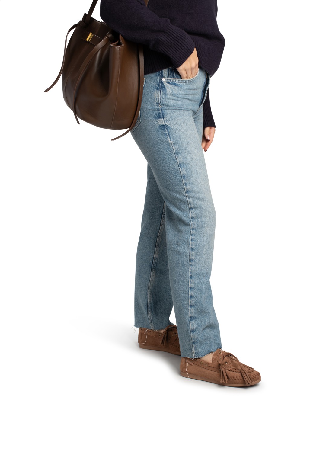 Woman wearing brown TAYLOR loafers with jeans