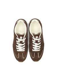 Top view of two brown sneakers with white laces placed side by side