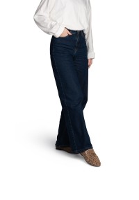 Side view of the PS Poelman SAMMY loafers with leopard print worn with blue flared jeans