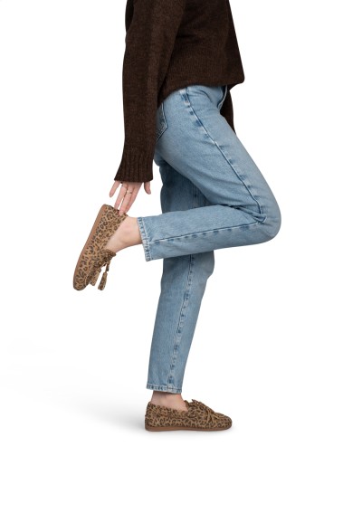 Leopard print loafer on foot, styled with jeans