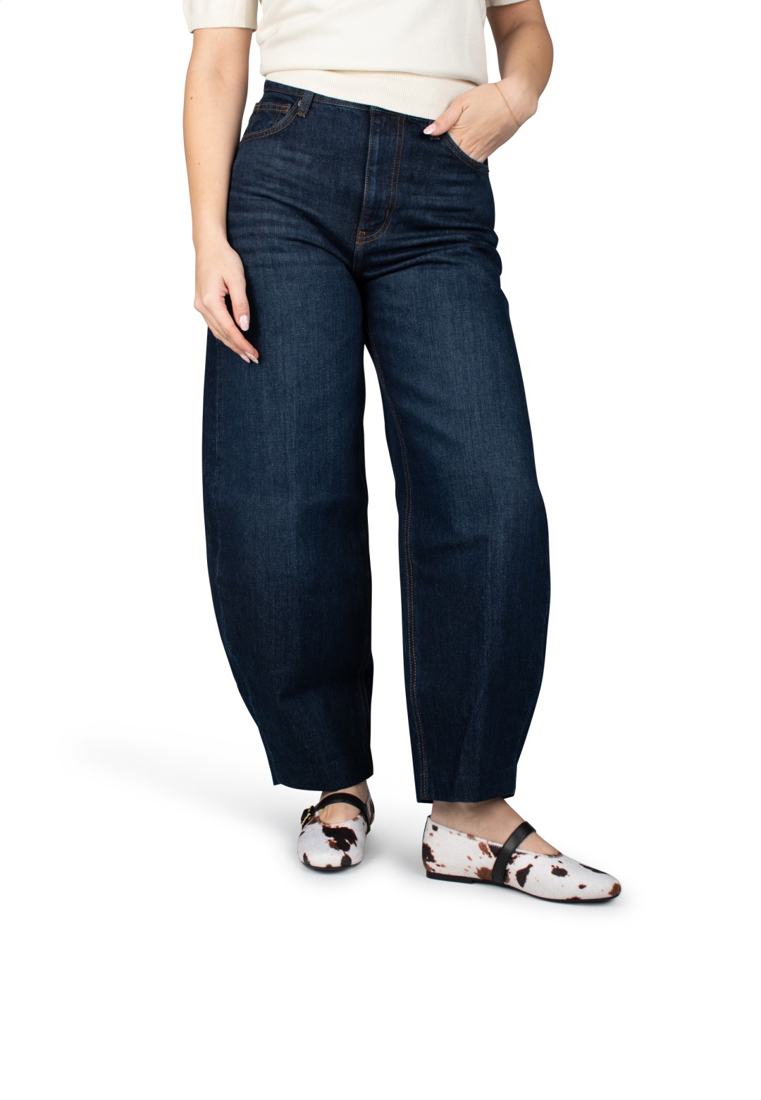 Gina cow print ballerinas worn with dark jeans – front view