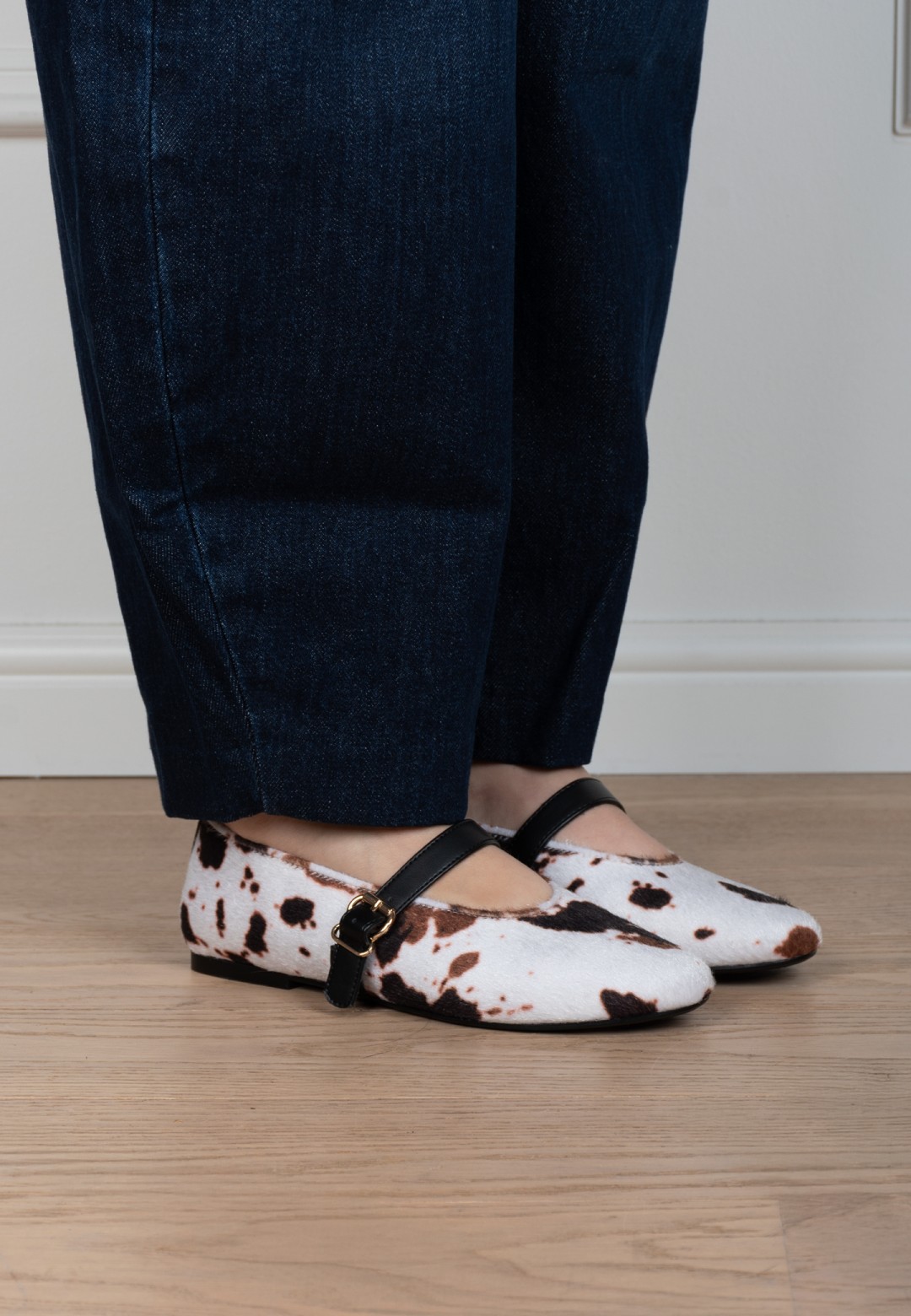 Gina cow print ballerinas worn indoors – detail view