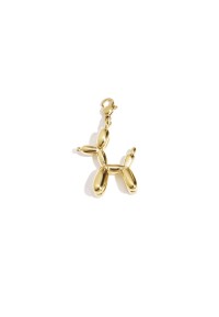 Gold charm in the shape of a balloon dog