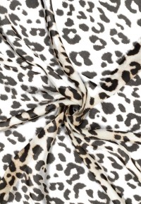 Close-up of leopard print fabric with twisted folds