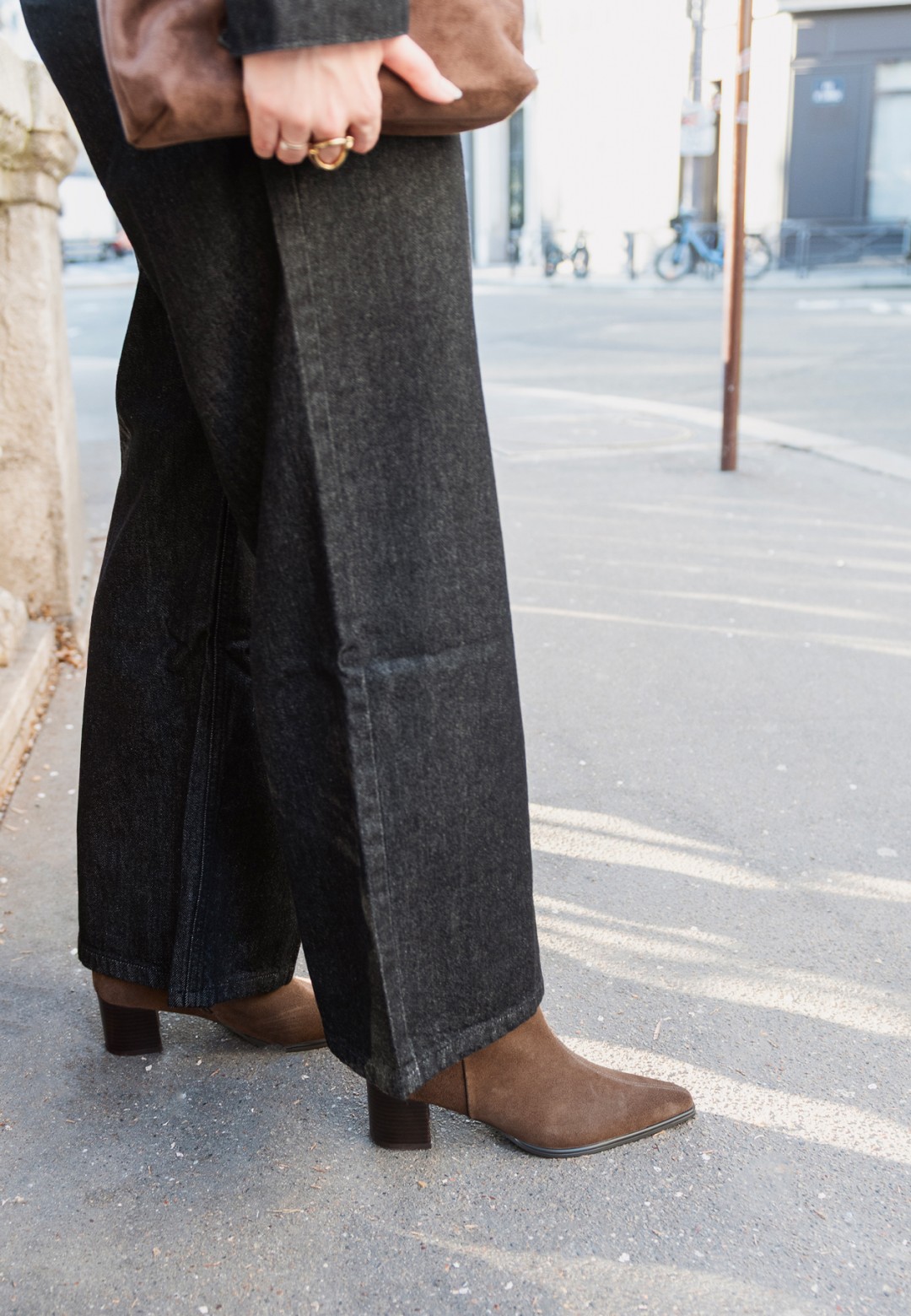 PS Poelman Febe brown suede ankle boots for women – close-up while worn with black trousers