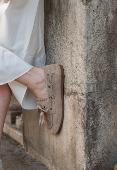 PS Poelman Lira beige loafers for women – close-up while worn against wall