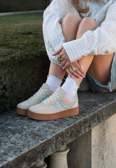 Close-up of the Georgia sneaker by POSH by Poelman combined with short denim and high socks.