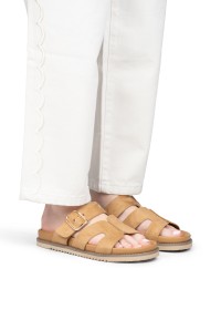 Model wearing POSH by Poelman Livia taupe sandals with light trousers – close-up
