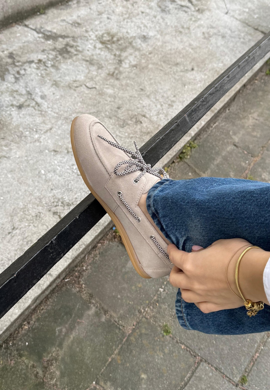 Model wearing PS Poelman Callie beige loafers with jeans – close-up