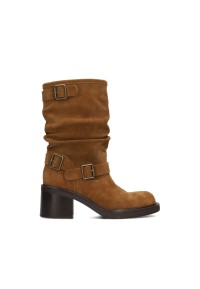 Side view of the brown PS Poelman boots with a ruched shaft, buckle details, and block heel