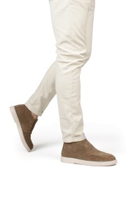 Model wearing PS Poelman Milan taupe slip-ons with light trousers – side view