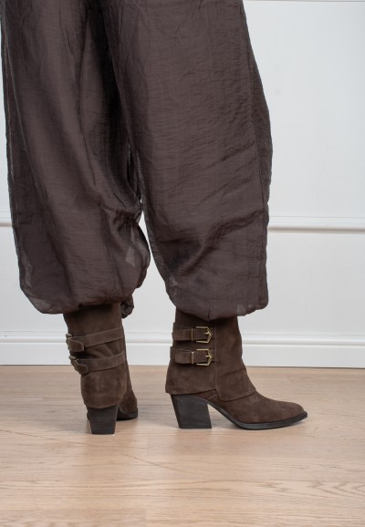 Model wearing Poelman Rosa brown boots with buckle details – back view