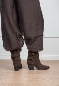 Model wearing Poelman Rosa brown boots with buckle details – back view