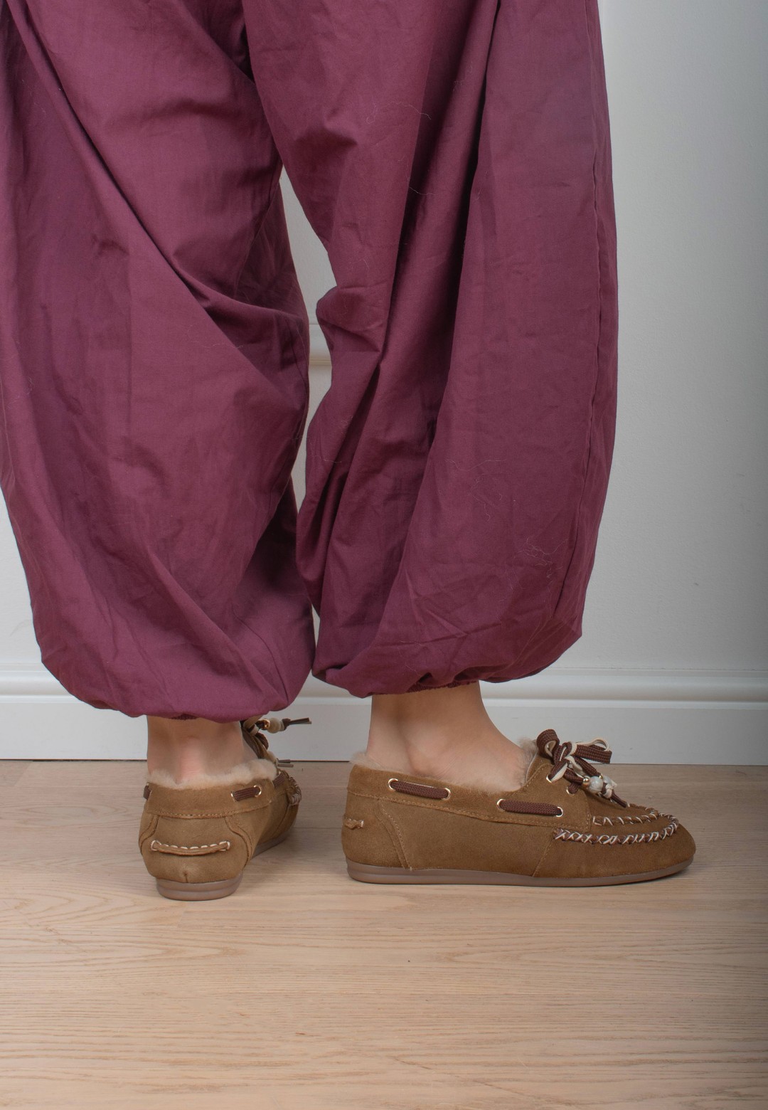Poelman KYRA cognac loafers worn with burgundy trousers