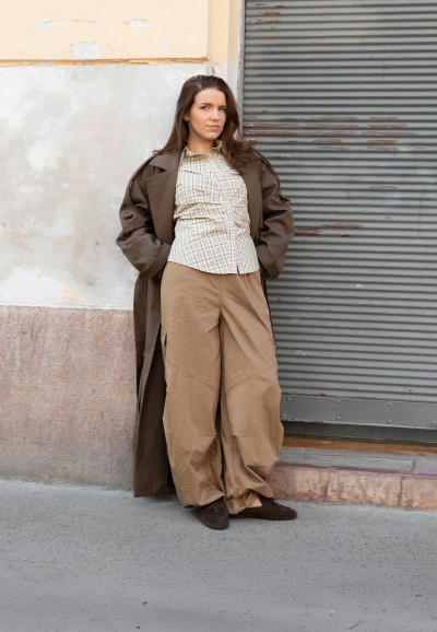 POSH by Poelman LOTTIE black loafers styled with beige trousers and a jacket