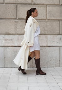 LINA medium brown boots styled with a white coat and shorts