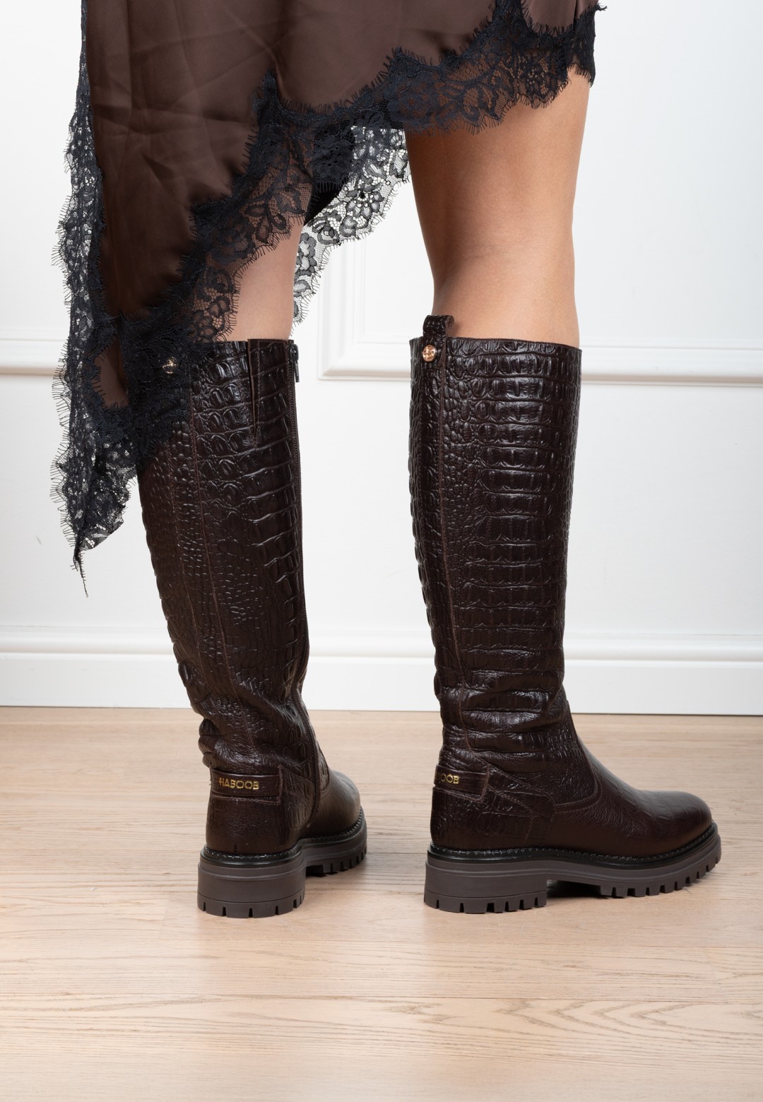 HABOOB LUNA dark brown leather boots worn with a short skirt, side and rear view